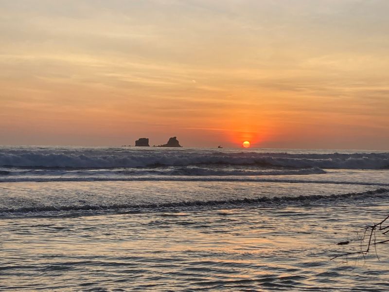 beautiful sunset in ayampe surf town with the mystery islands